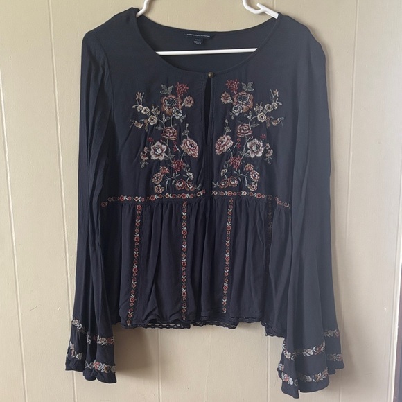 American Eagle Outfitters Tops - American Eagle Outfitters Navy blue Floral Blouse. Bell sleeves 
Size M